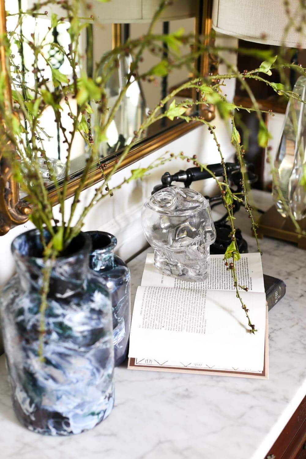 DIY Marbled Vases and Halloween Entryway | unigumushane.com - A quick tutorial for how to turn old jars and bottles into marbled vases (using nail polish) on the cheap that are modern works of art.