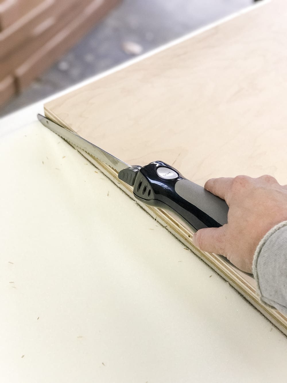 DIY Ottoman Bench from a Repurposed Thrift Store Coffee Table | unigumushane.com - How to repurpose an old coffee table into a designer-inspired ottoman bench with tips for getting a faux weathered wood look and how to tuft upholstery #furnituremakeover #ottoman #coffeetable