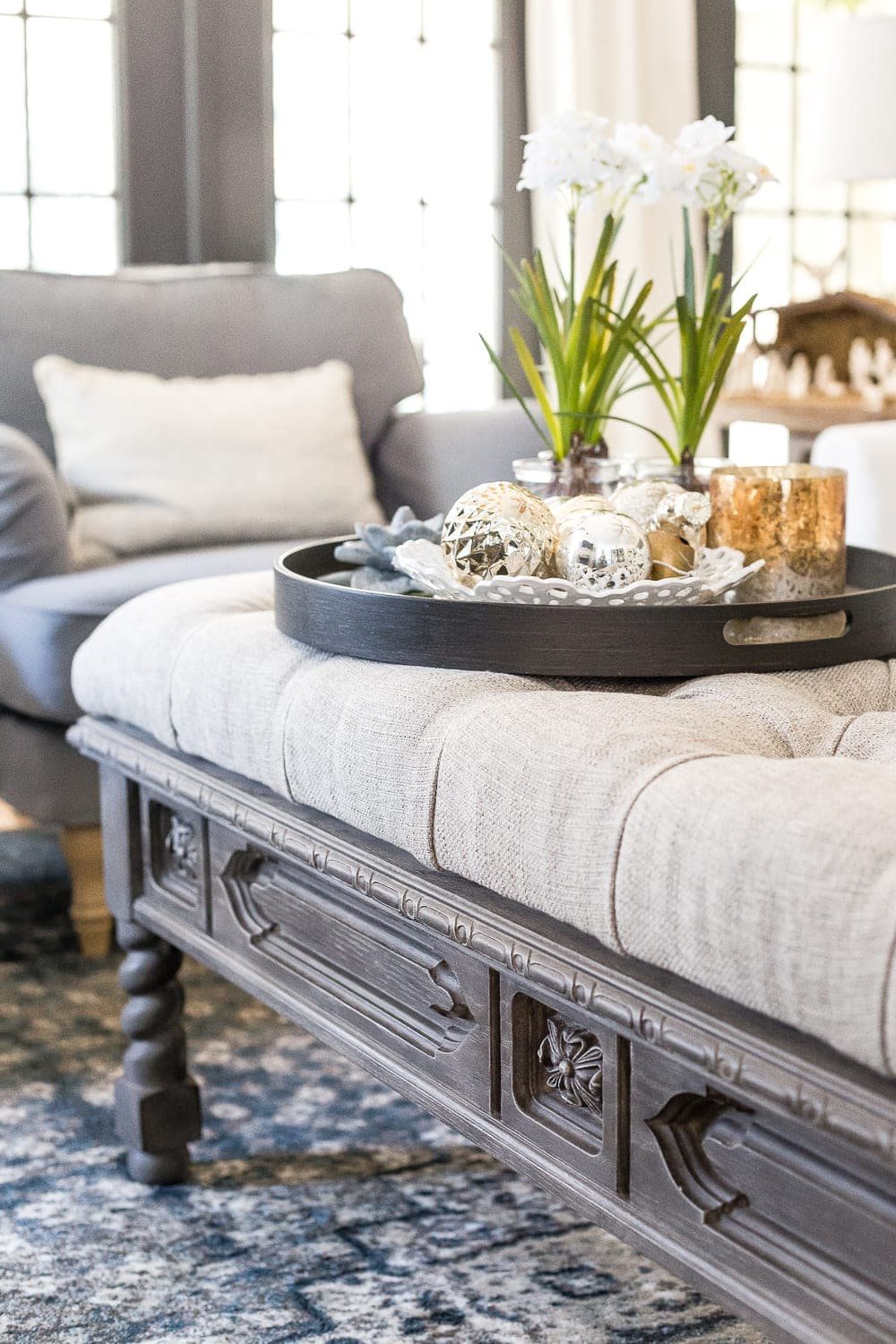 DIY Ottoman Bench from a Repurposed Thrift Store Coffee Table | unigumushane.com - How to repurpose an old coffee table into a designer-inspired ottoman bench with tips for getting a faux weathered wood look and how to tuft upholstery #furnituremakeover #ottoman #coffeetable