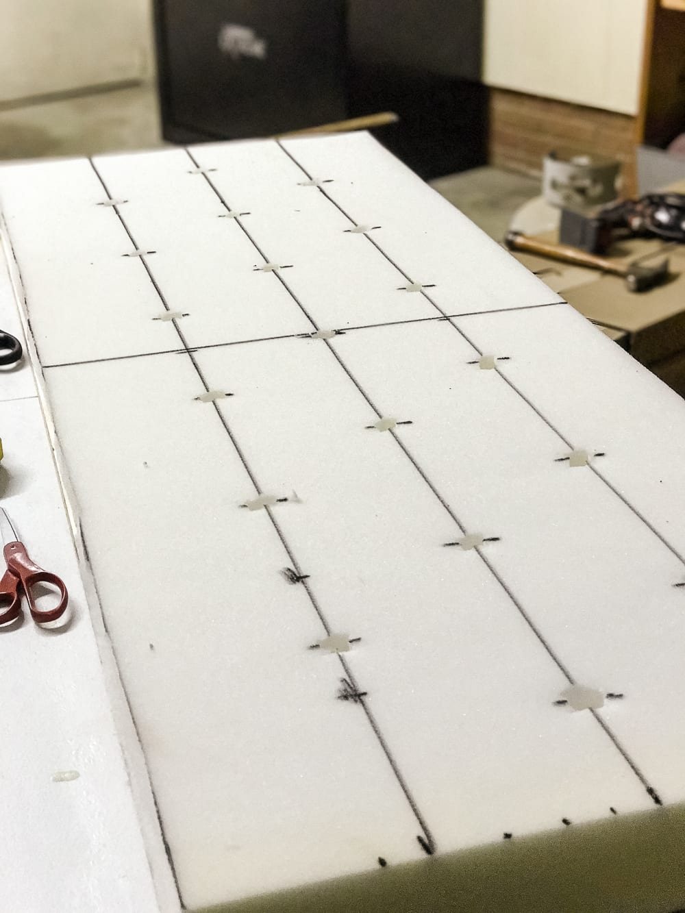 DIY Ottoman Bench from a Repurposed Thrift Store Coffee Table | unigumushane.com - How to repurpose an old coffee table into a designer-inspired ottoman bench with tips for getting a faux weathered wood look and how to tuft upholstery #furnituremakeover #ottoman #coffeetable