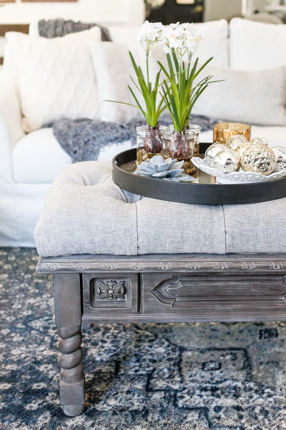 DIY Ottoman Bench from a Repurposed Thrift Store Coffee Table | unigumushane.com - How to repurpose an old coffee table into a designer-inspired ottoman bench with tips for getting a faux weathered wood look and how to tuft upholstery #furnituremakeover #ottoman #coffeetable