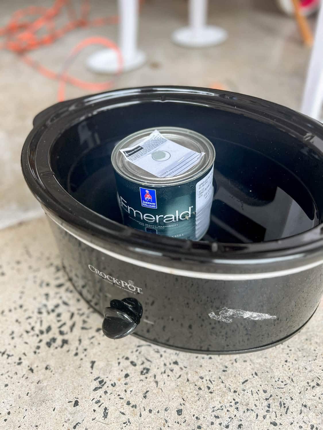 warming a can of gloss paint in a slow cooker for smooth paint finish