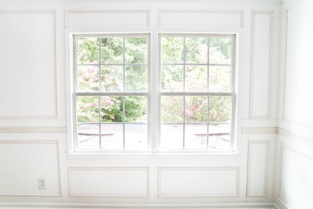 A step-by-step tutorial for hanging picture frame molding wainscoting and a shortcut to make it easier.