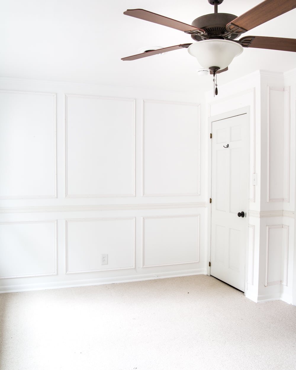 A step-by-step tutorial for hanging picture frame molding wainscoting and a shortcut to make it easier.