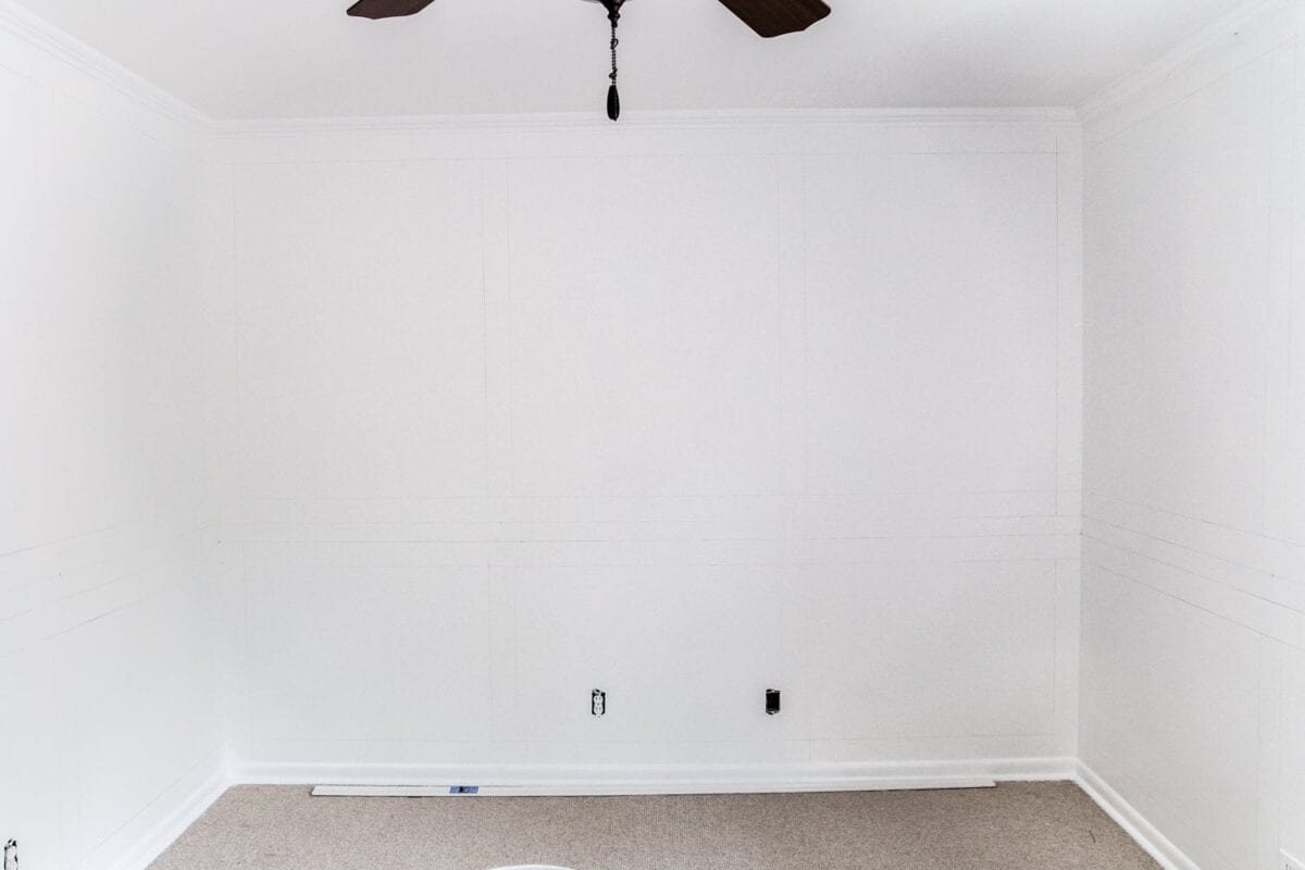 A step-by-step tutorial for hanging picture frame molding wainscoting and a shortcut to make it easier.