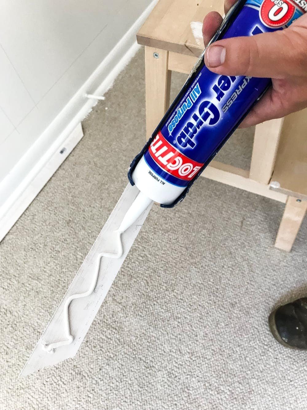 use construction adhesive to make attaching picture frame molding to walls easier