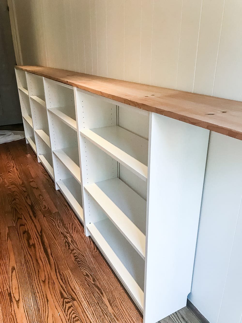 An easy to follow step-by-step tutorial showing how to build bookcase built-ins using IKEA Billy bookcases. #IKEAhack #homeimprovement #build #playroom