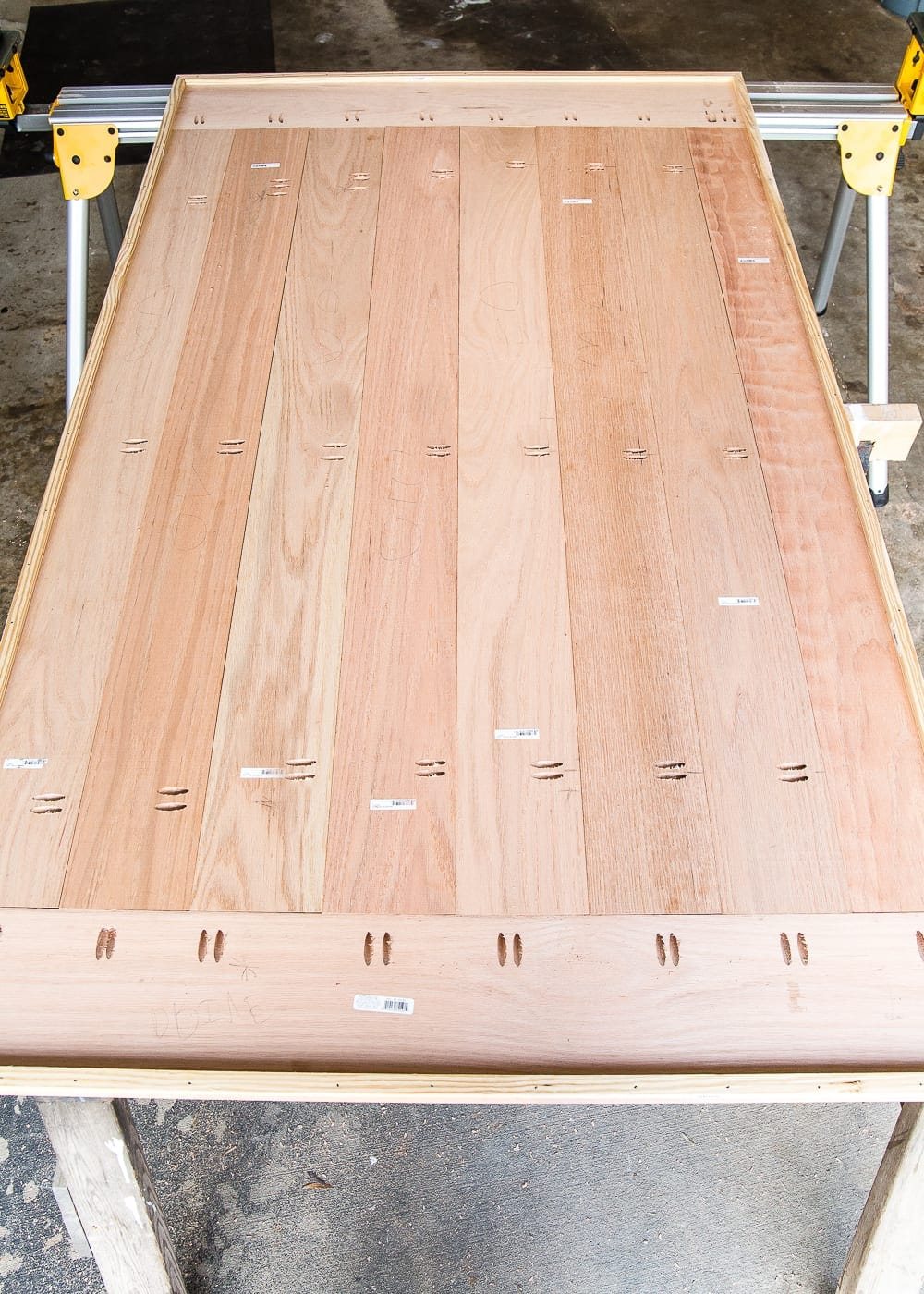 A tutorial for how to build a retrofitted table top to fit over any existing table using Minwax Dark Walnut stain. #build #furniturebuilding #tabletop #diningtable #diytable #farmhousetable #diyfurniture #woodworking #furnituremakeover #tablemakeover #minwax #woodstain #walnut