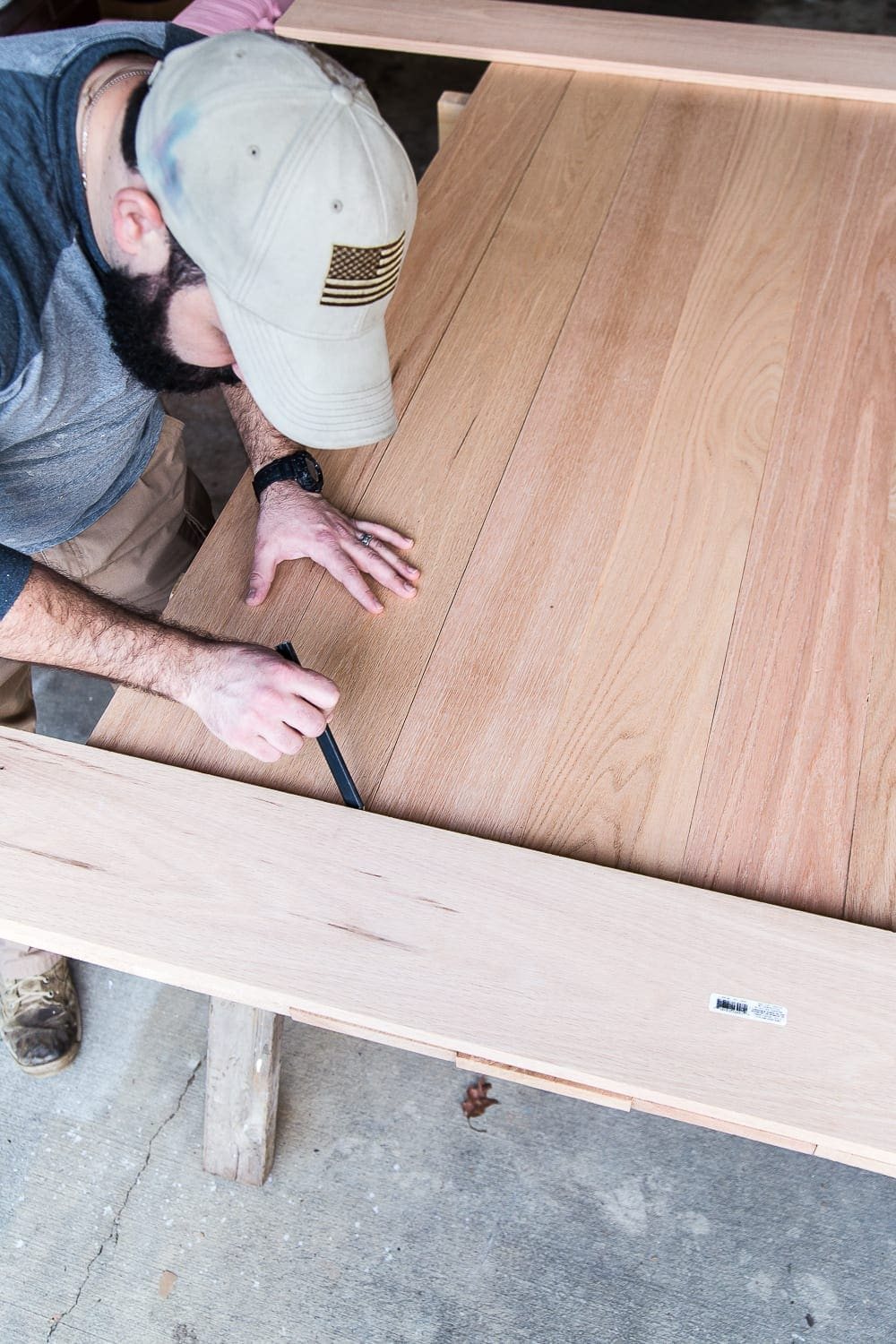 A tutorial for how to build a retrofitted table top to fit over any existing table using Minwax Dark Walnut stain. #build #furniturebuilding #tabletop #diningtable #diytable #farmhousetable #diyfurniture #woodworking #furnituremakeover #tablemakeover #minwax #woodstain #walnut