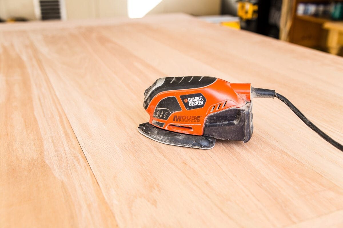 A tutorial for how to build a retrofitted table top to fit over any existing table using Minwax Dark Walnut stain. #build #furniturebuilding #tabletop #diningtable #diytable #farmhousetable #diyfurniture #woodworking #furnituremakeover #tablemakeover #minwax #woodstain #walnut