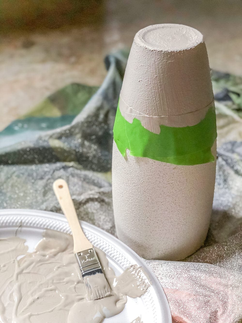 How to add a stoneware look to thrifted glass vases and bottles using just paint. #stoneware #diystoneware #stonewarevase