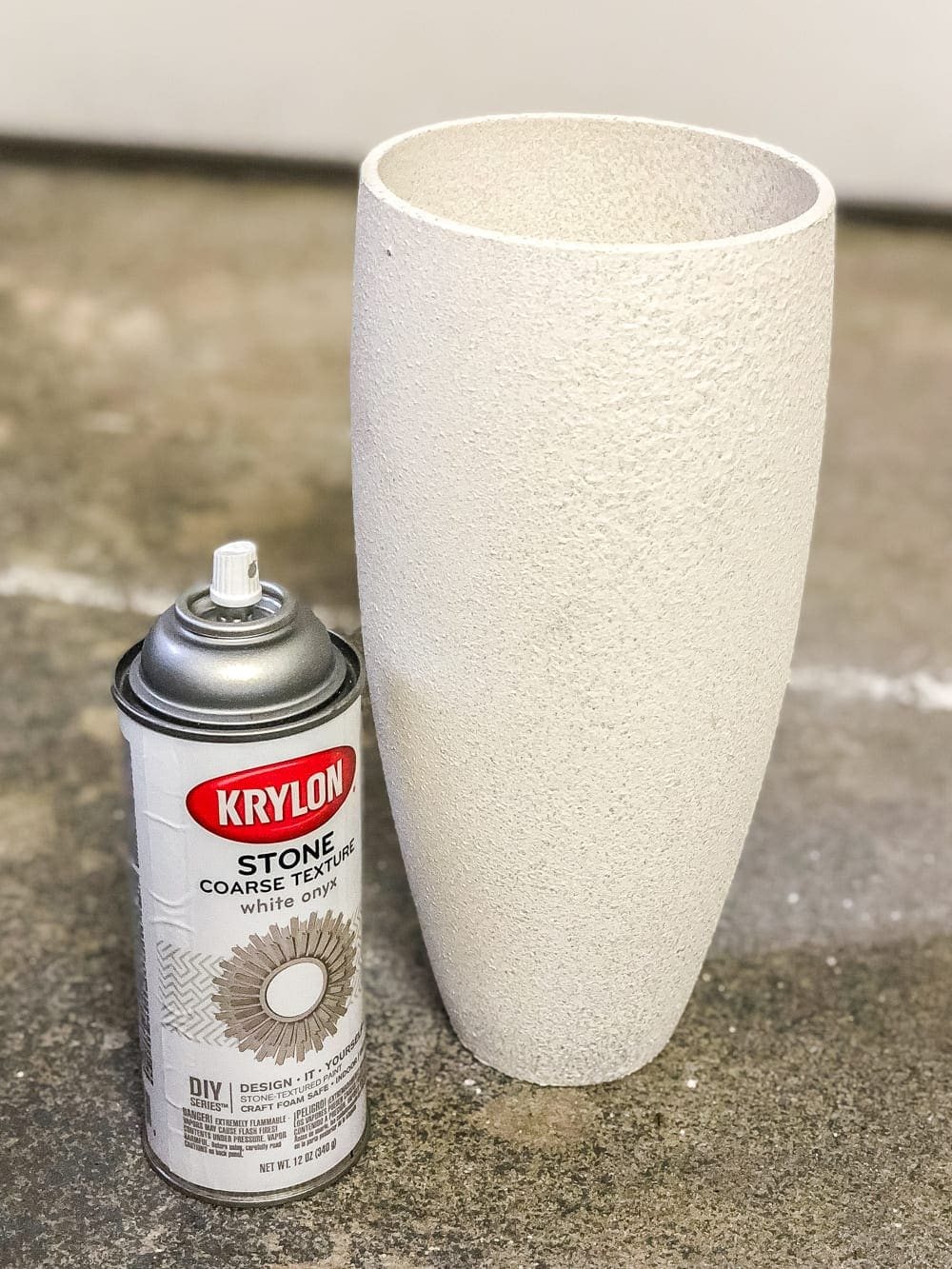 How to add a stoneware look to thrifted glass vases and bottles using just paint. #stoneware #diystoneware #stonewarevase
