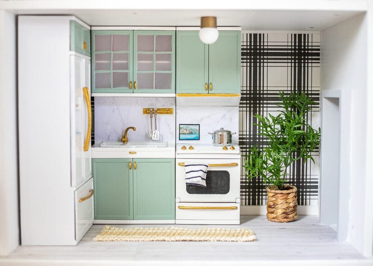 doll kitchen in a DIY dollhouse using scrapbook paper and Barbie furniture