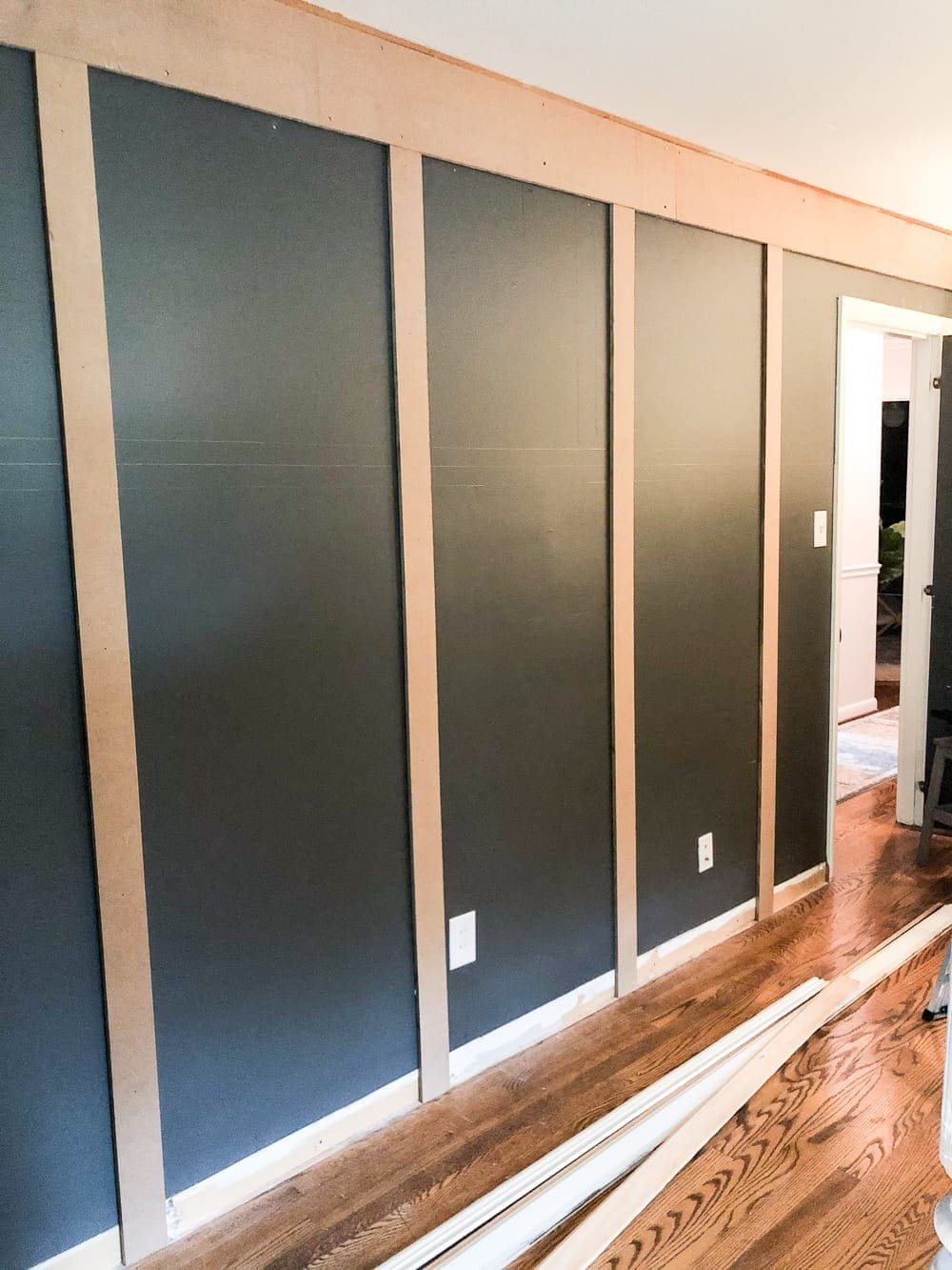 DIY Traditional Style Grid Molding Focal Wall | How to build a traditional style board and batten grid molding focal wall to add character and depth to any room.