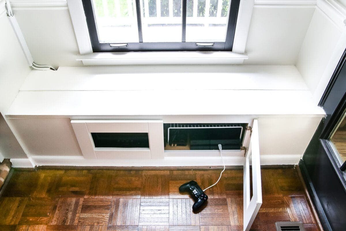 DIY Window Seat from a Kitchen Cabinet | unigumushane.com - A simplified tutorial for how to build a DIY window seat using a prefabbed kitchen cabinet to house electronics and hide cords.