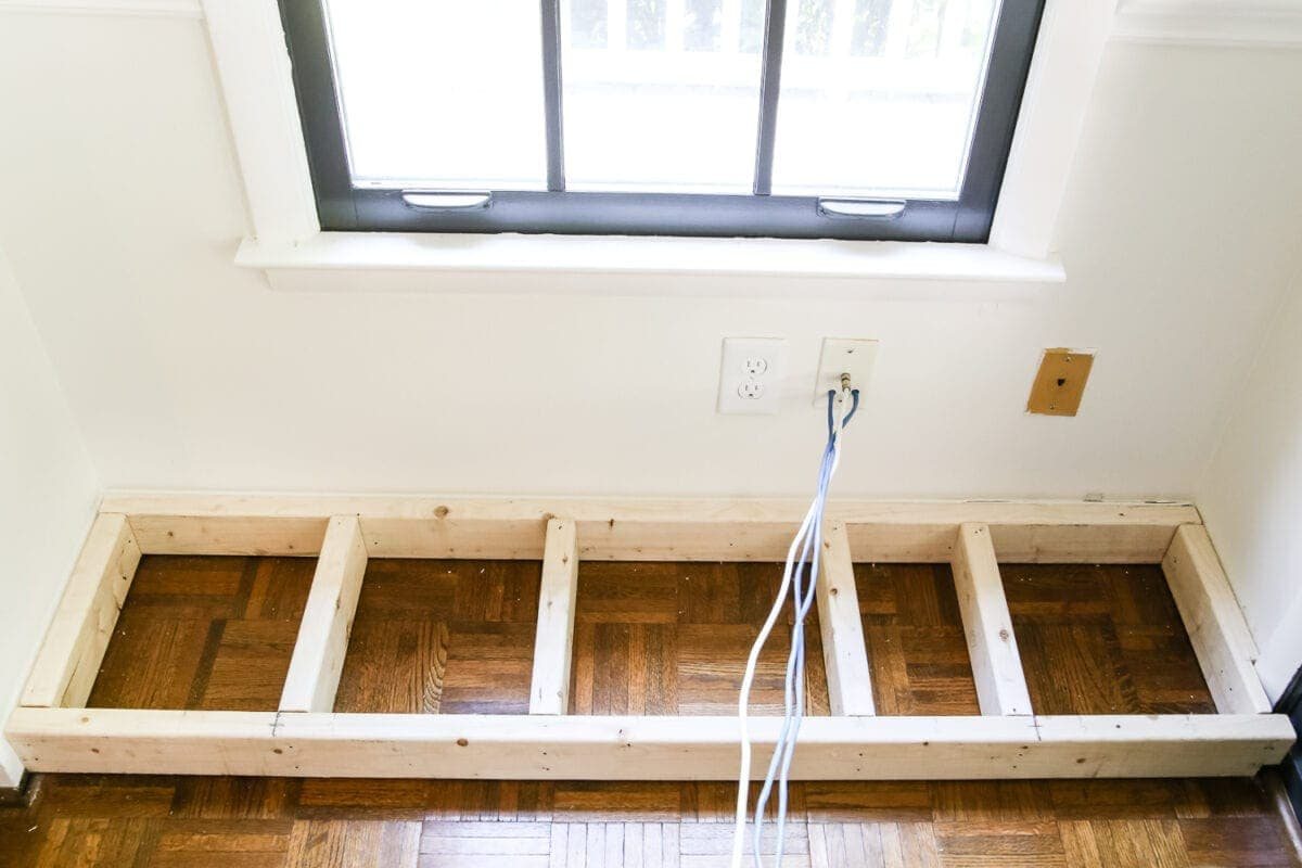 DIY Window Seat from a Kitchen Cabinet | unigumushane.com - A simplified tutorial for how to build a DIY window seat using a prefabbed kitchen cabinet to house electronics and hide cords.