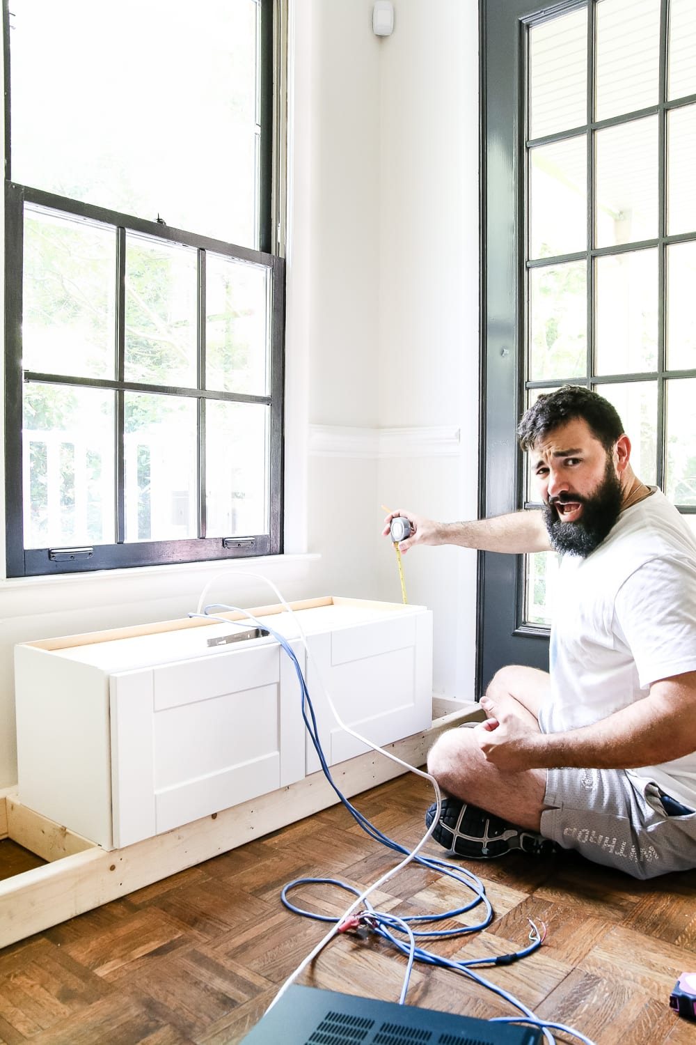 DIY Window Seat from a Kitchen Cabinet | unigumushane.com - A simplified tutorial for how to build a DIY window seat using a prefabbed kitchen cabinet to house electronics and hide cords.