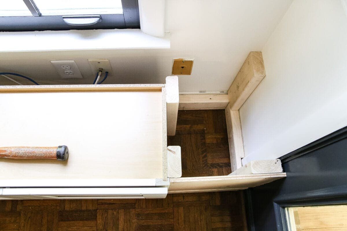 DIY Window Seat from a Kitchen Cabinet | unigumushane.com - A simplified tutorial for how to build a DIY window seat using a prefabbed kitchen cabinet to house electronics and hide cords.