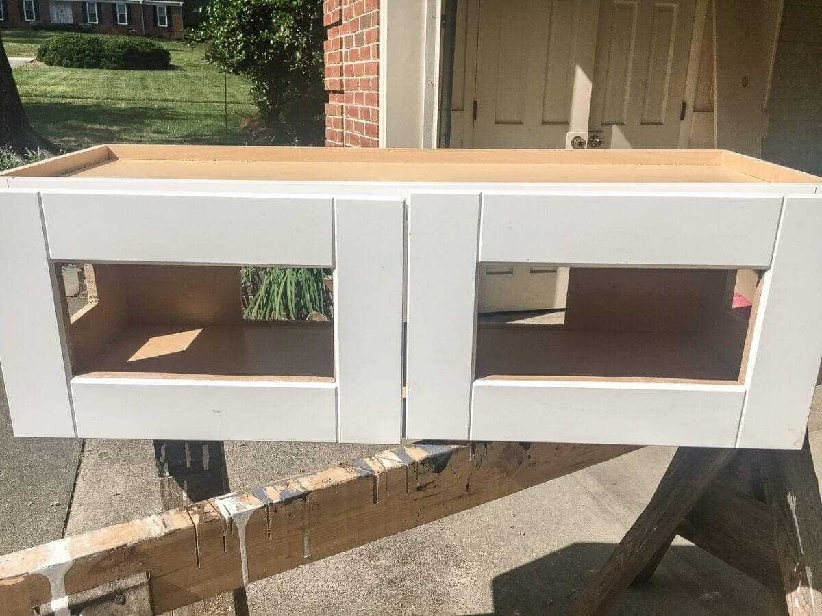 DIY Window Seat from a Kitchen Cabinet | unigumushane.com - A simplified tutorial for how to build a DIY window seat using a prefabbed kitchen cabinet to house electronics and hide cords.