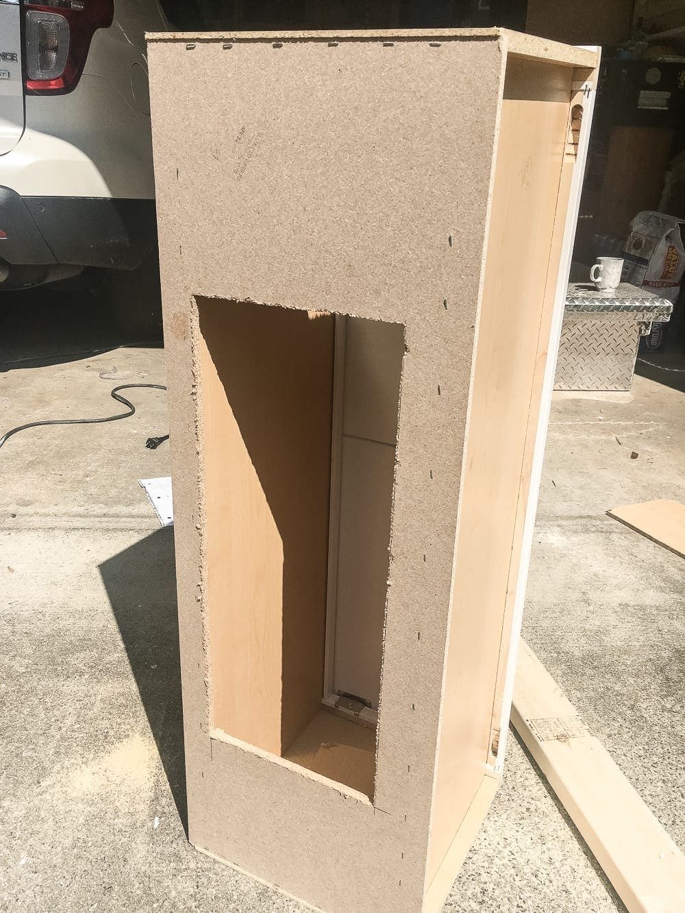 DIY Window Seat from a Kitchen Cabinet | unigumushane.com - A simplified tutorial for how to build a DIY window seat using a prefabbed kitchen cabinet to house electronics and hide cords.
