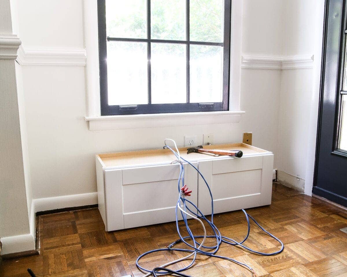 DIY Window Seat from a Kitchen Cabinet | unigumushane.com - A simplified tutorial for how to build a DIY window seat using a prefabbed kitchen cabinet to house electronics and hide cords.
