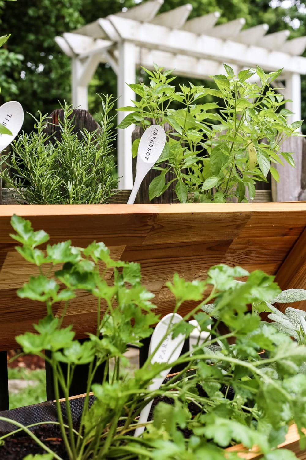DIY Wooden Spoon Garden Markers | unigumushane.com - A simple tutorial for how to craft your own vintage-inspired garden markers made from wooden spoons, plus a resource for a beautiful stacked herb garden.