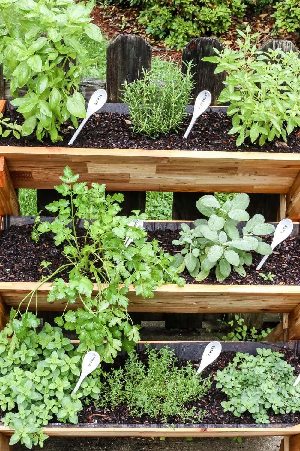 DIY Wooden Spoon Garden Markers | unigumushane.com - A simple tutorial for how to craft your own vintage-inspired garden markers made from wooden spoons, plus a resource for a beautiful stacked herb garden.