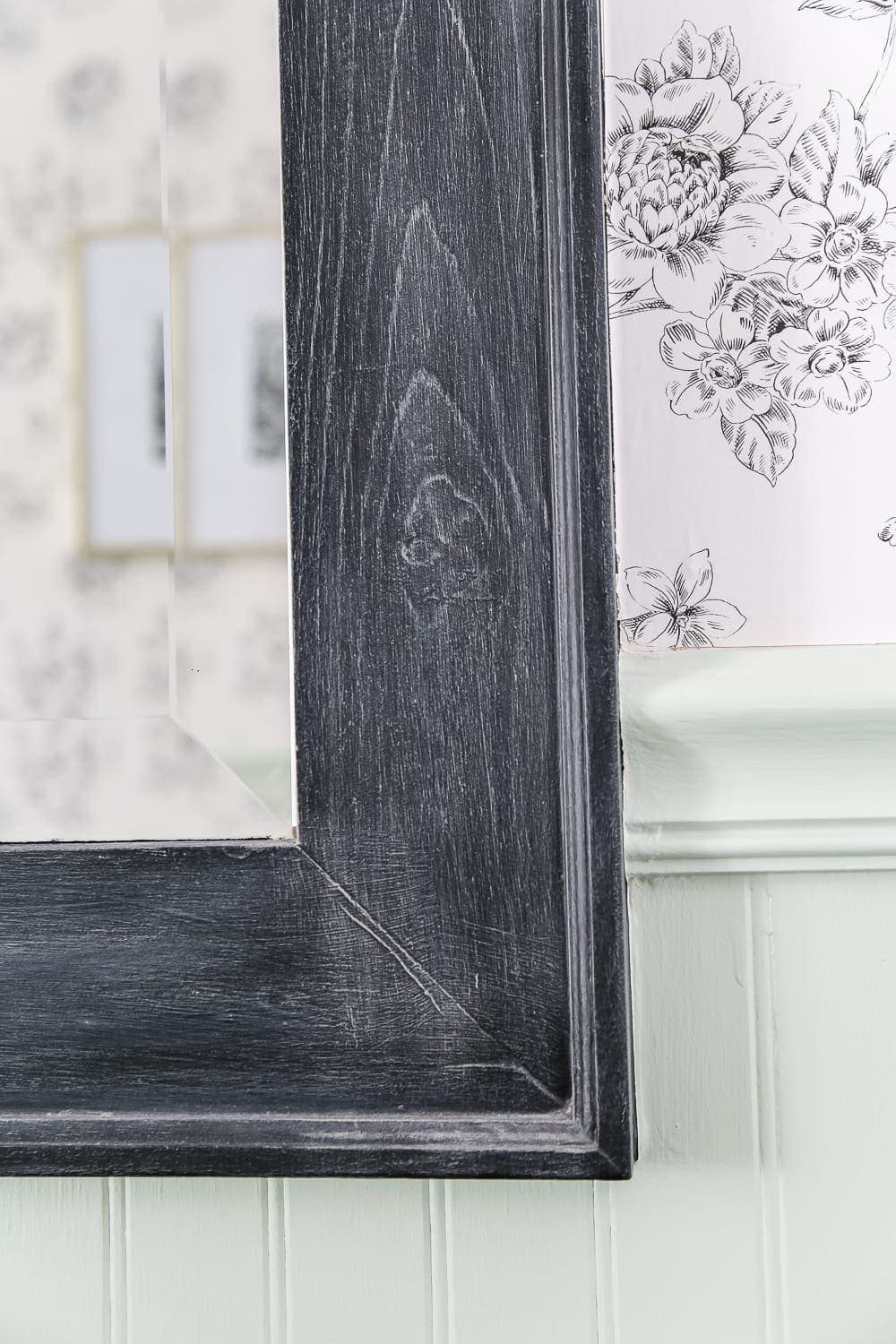 Dry Brushed Black Mirror Makeover | unigumushane.com - A plain, white painted bathroom mirror gets a high-drama weathered makeover with black paint and dry brushing. (Tutorial)