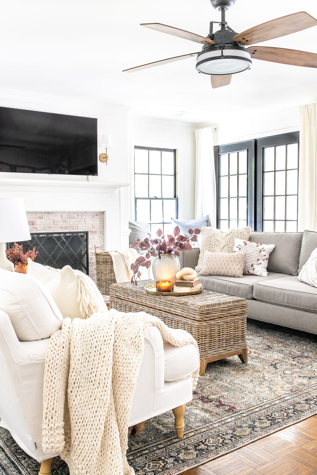 fall living room with fall leaves and vintage style rug