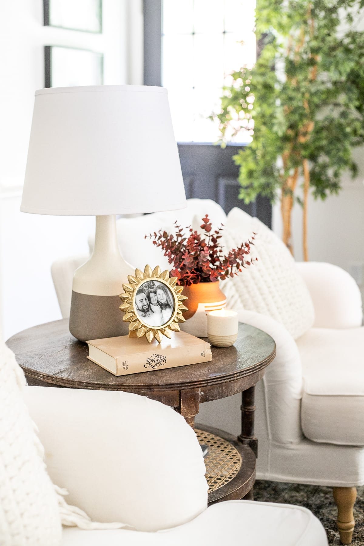 living room end table with fall stems in vase