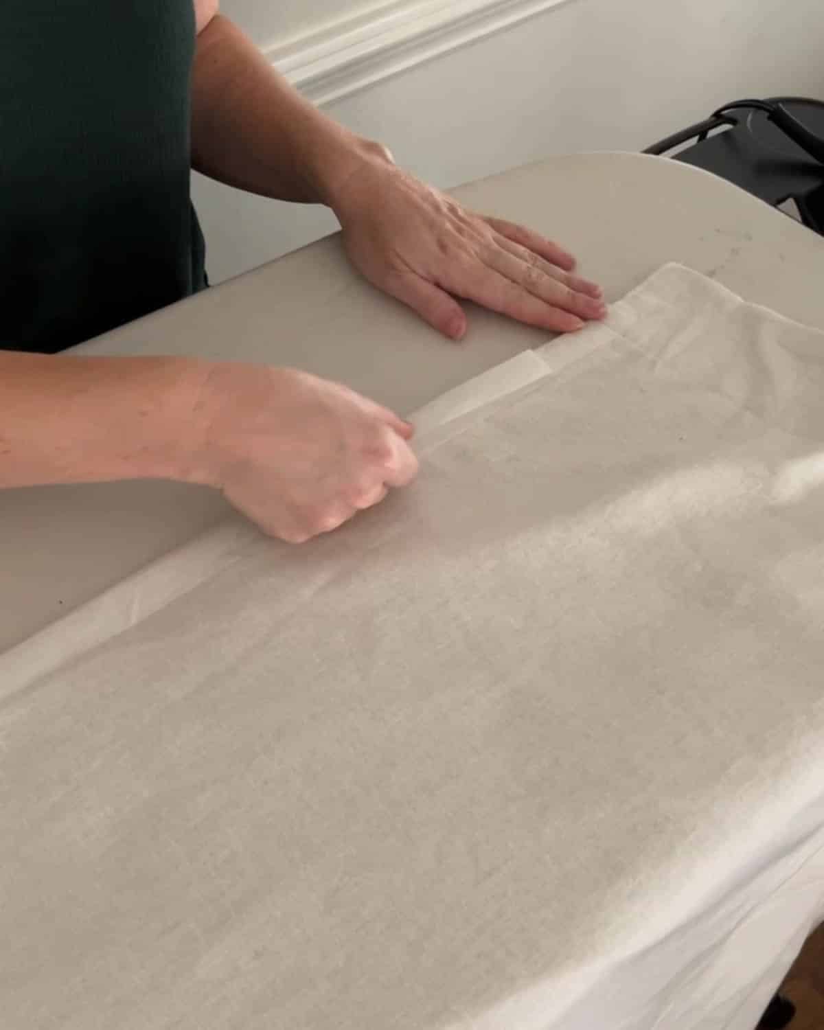 adding hemming tape to curtains