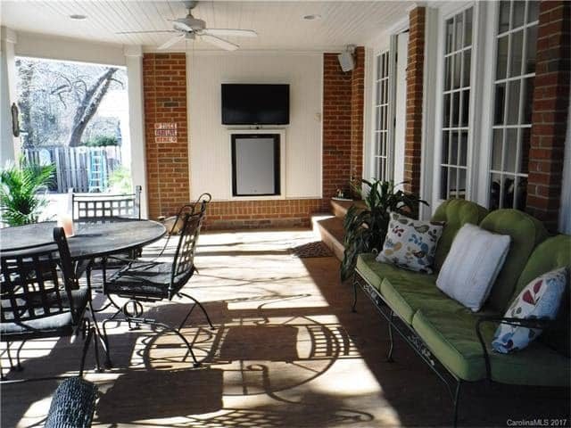 back porch before with mini fridge niche and TV