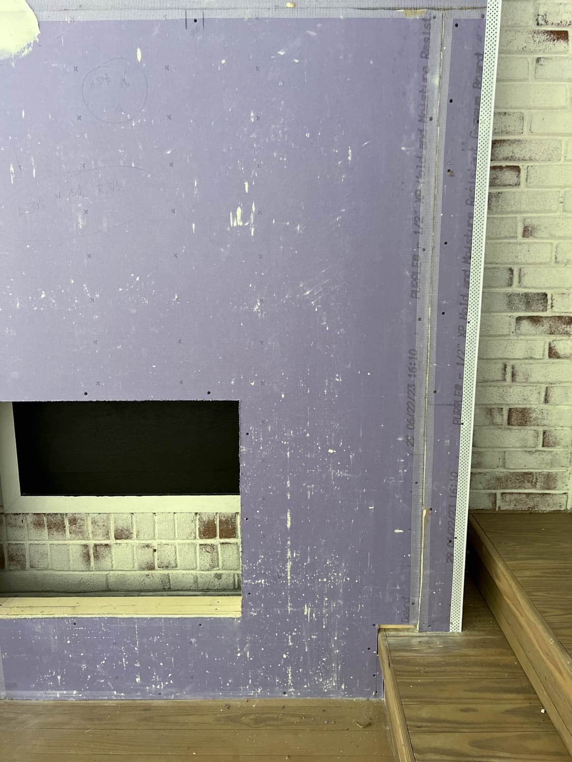 taped drywall on a fireplace