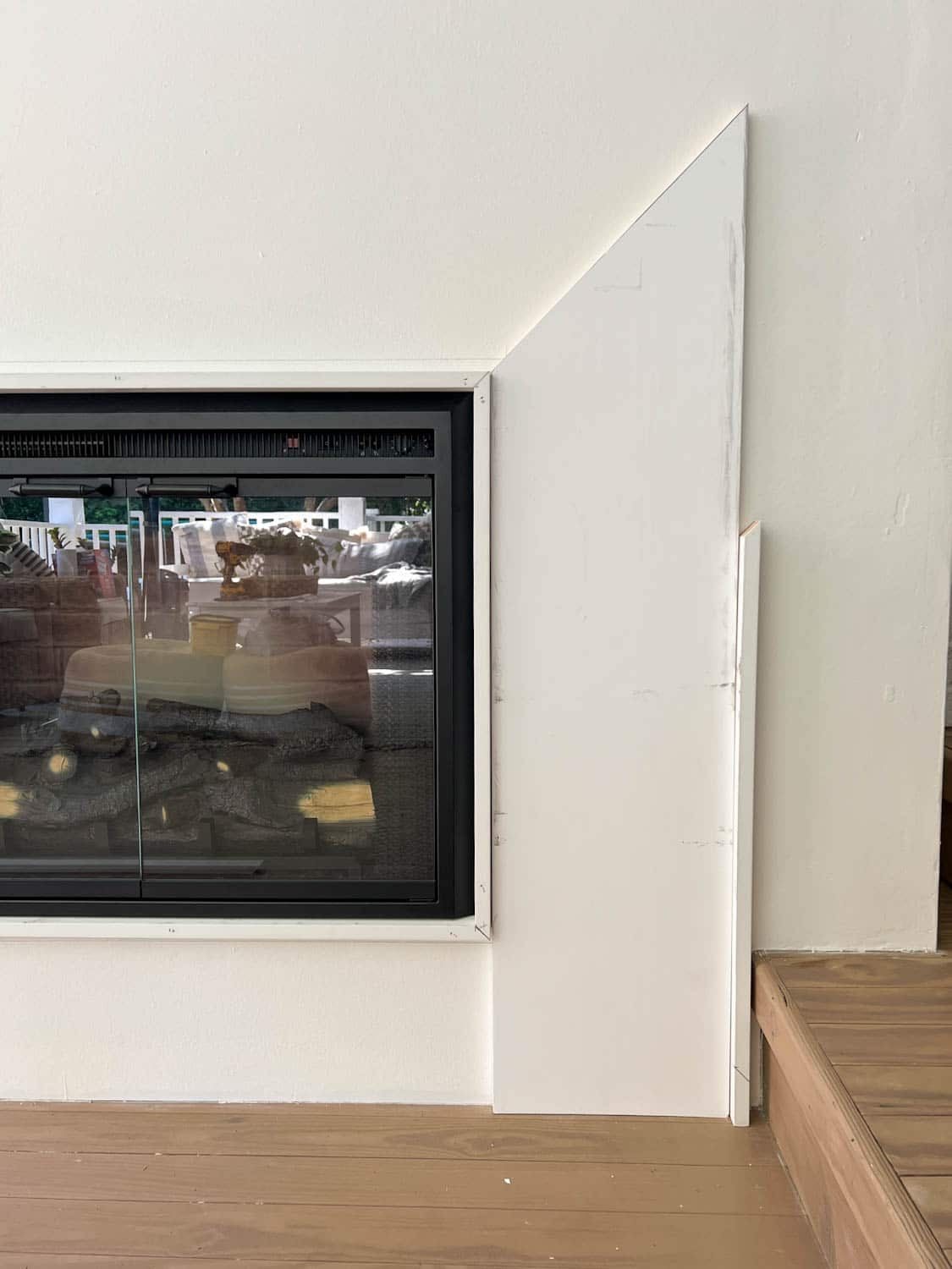building a DIY fireplace surround with 1x2 boards, 1x12 boards, and 1x4 boards