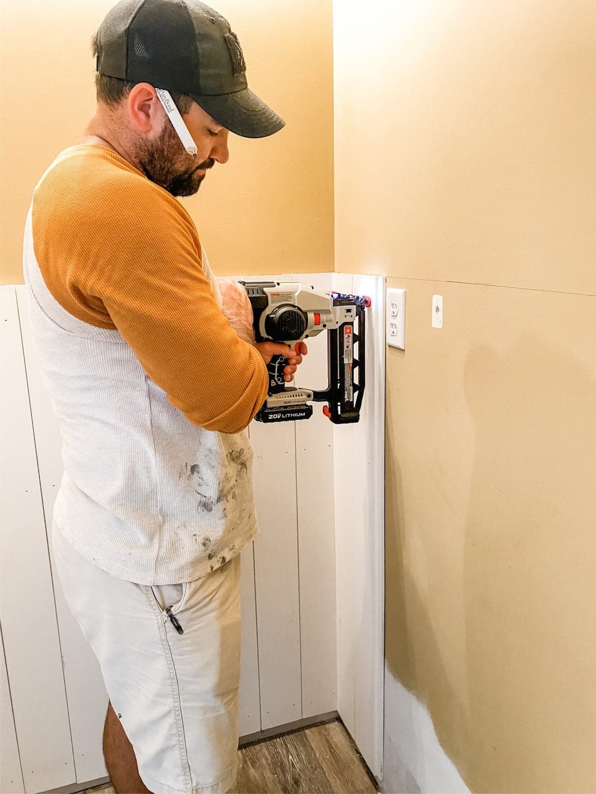 nailing vertical shiplap boards to a wall