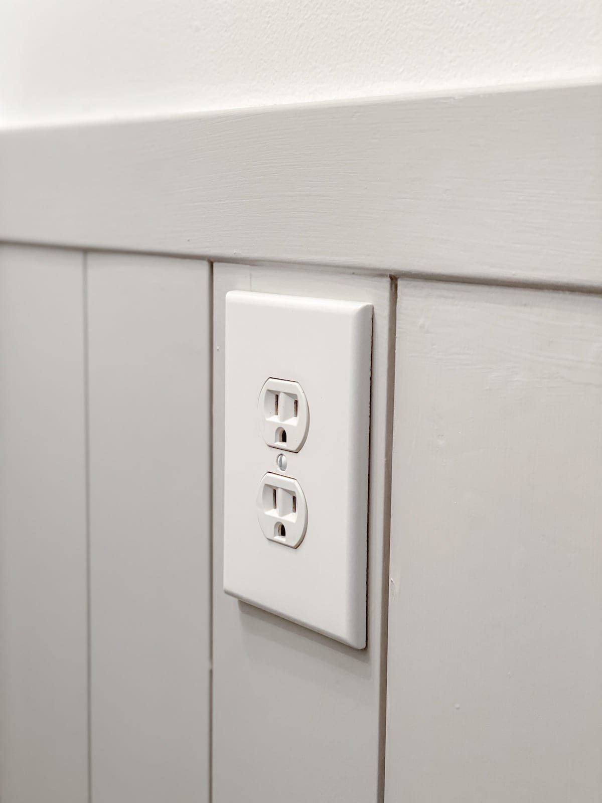 outlet spacers to push out outlet flush with shiplap in a bathroom