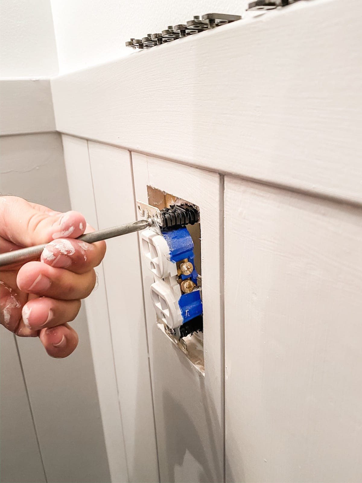 outlet spacers to push out outlet flush with shiplap in a bathroom