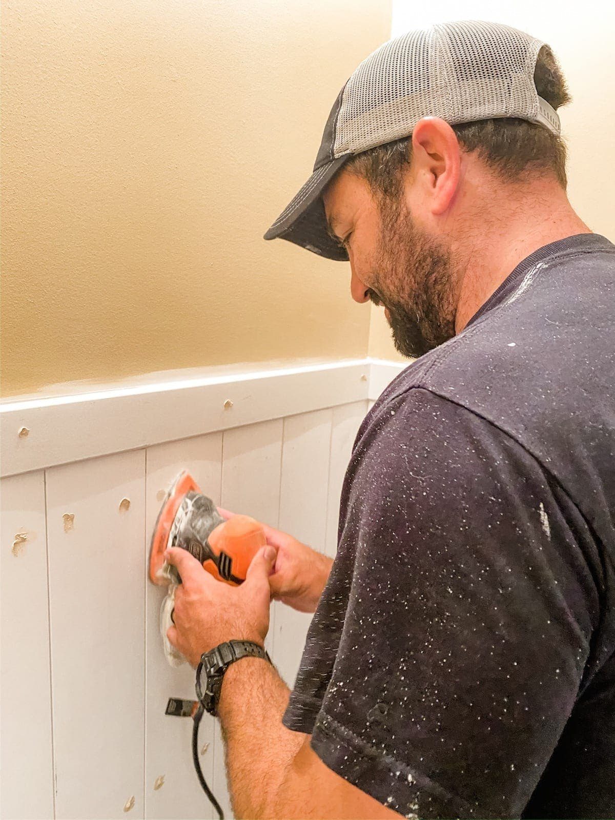 sanding wood filler on vertical planks