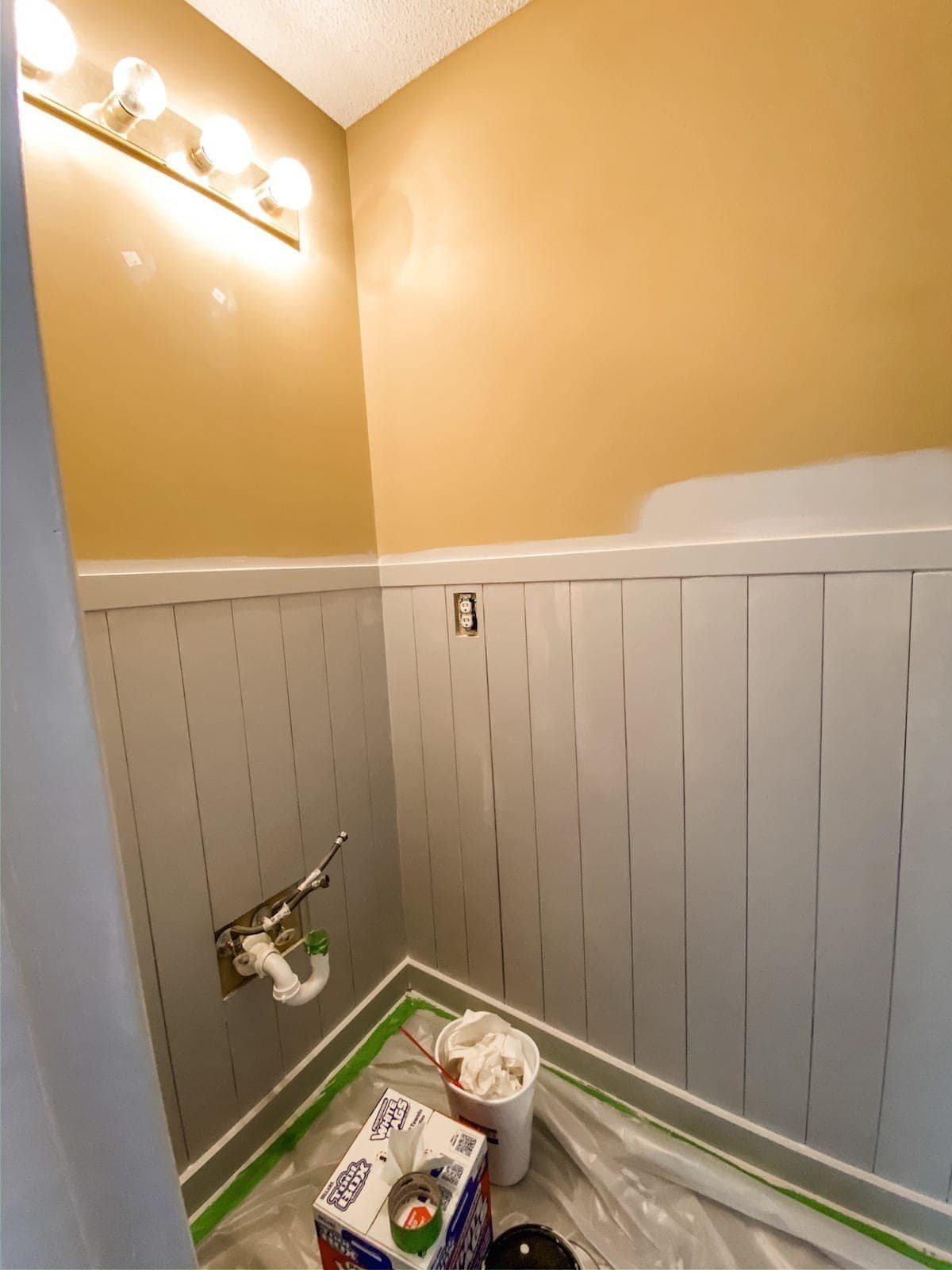 painting vertical shiplap wainscoting in a bathroom