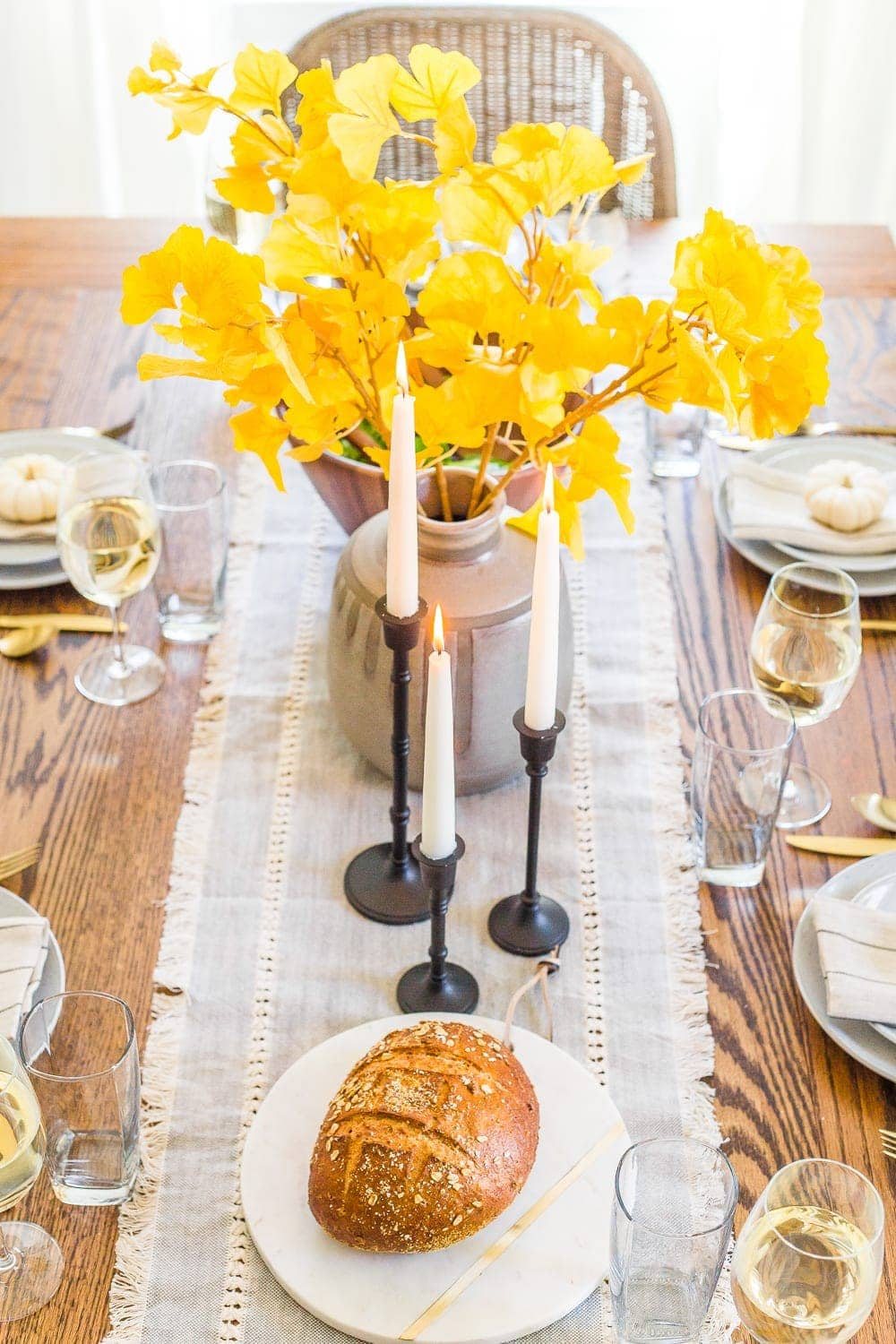 snipped yellow ginkgo branches from the yard in a vase for cheap fall decor