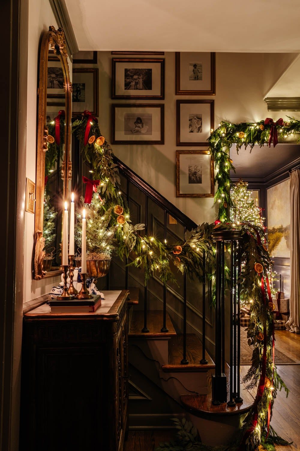 traditional candlelight Christmas night tour in entryway with nativity