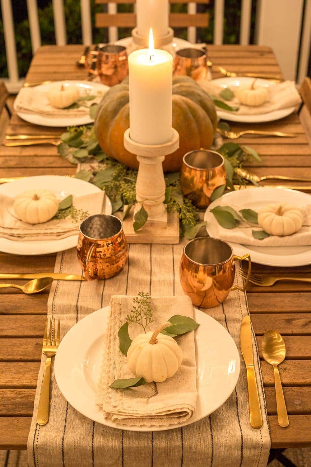Fall Back Porch at Night | How to style your outdoor spaces for autumn using capsule decor items that will last throughout the seasons and get the most bang for your buck.
