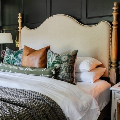 fall pillows on a bed with leather, velvet, and cotton