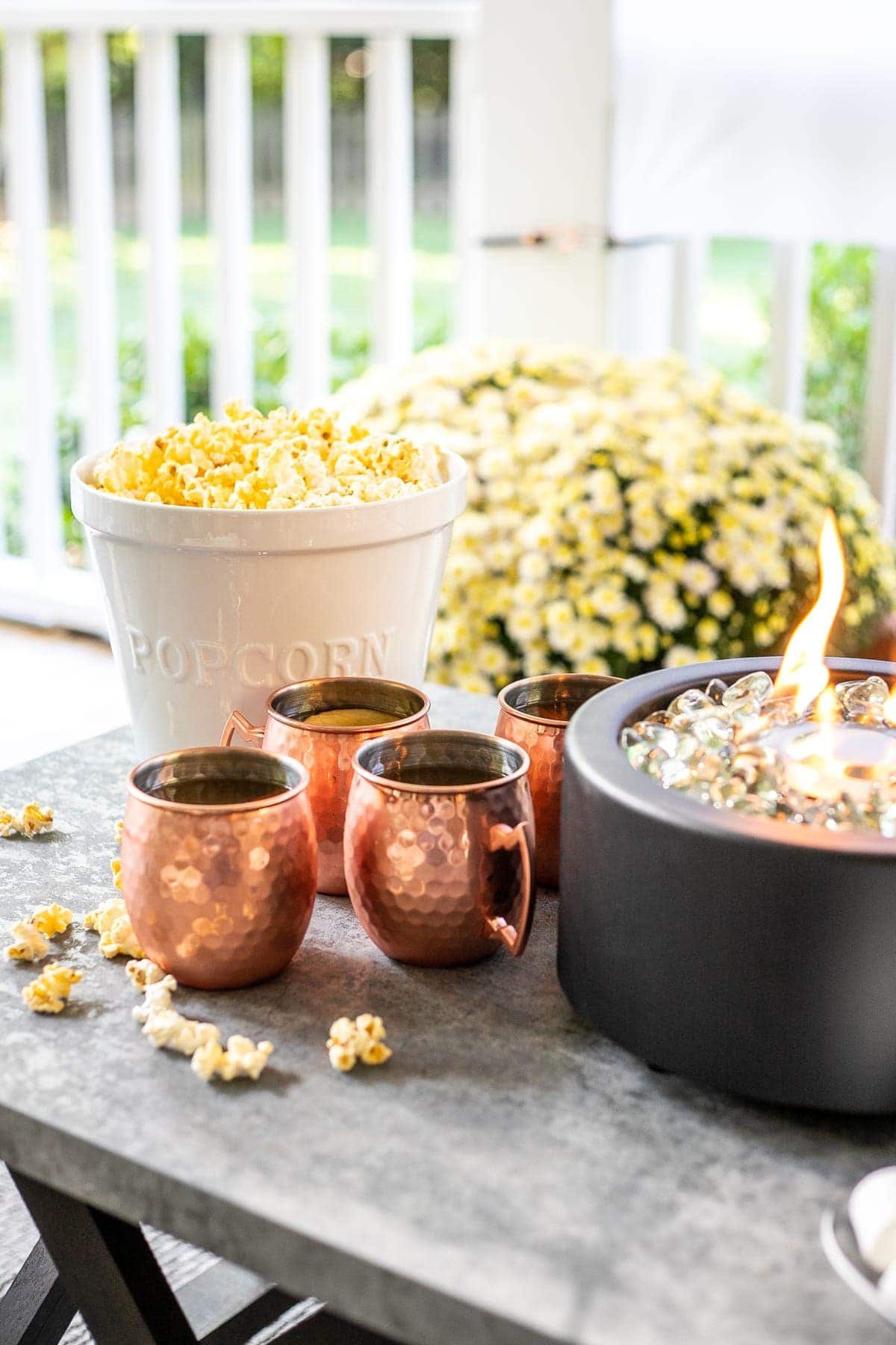 Copper mugs, popcorn, and fire bowl