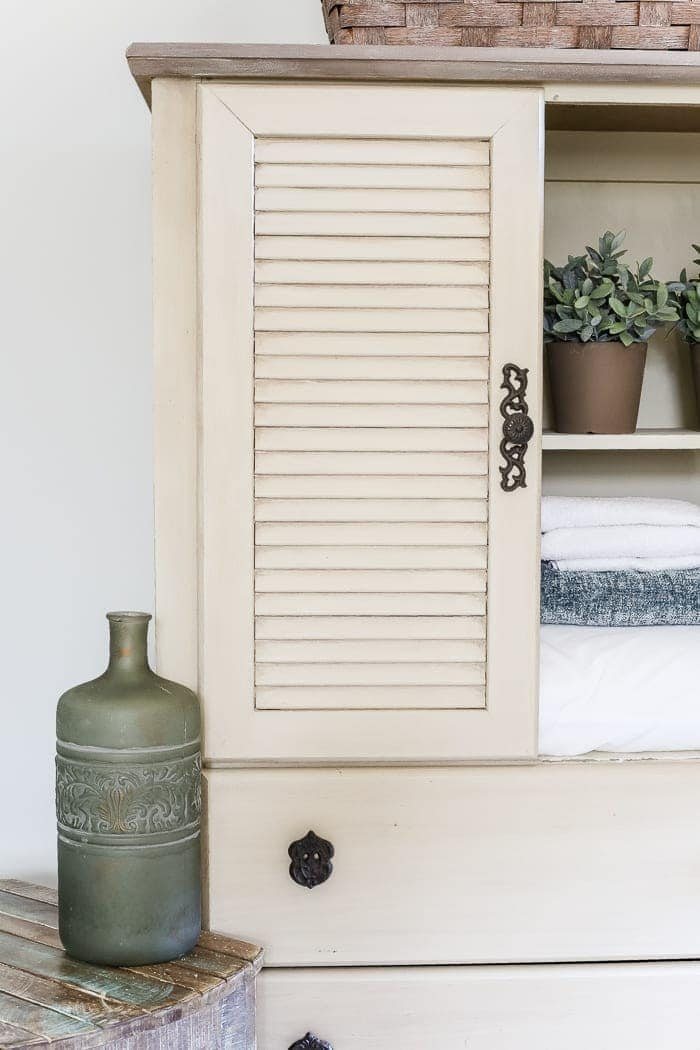 Faux Antique Shutter Armoire Makeover | unigumushane.com - A basic veneer cabinet gets a faux antique makeover using Fusion Mineral Paint in the color Plaster aged with Espresso wax and cast iron hardware.