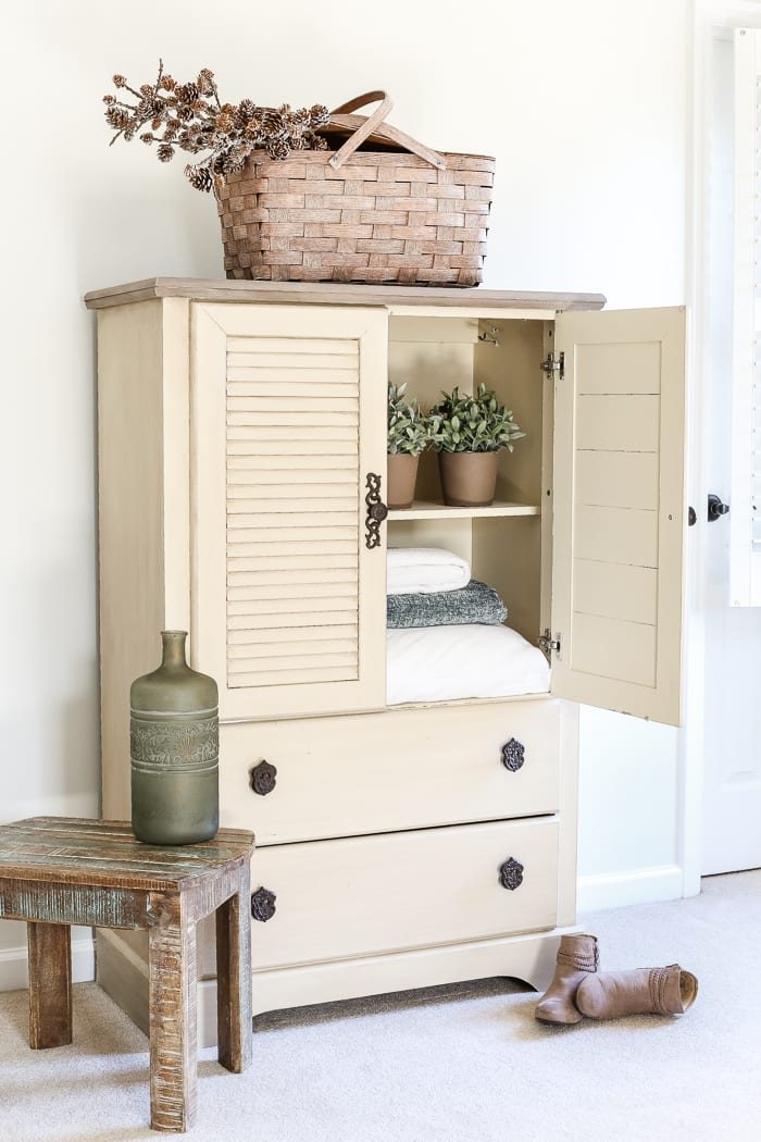 Faux Antique Shutter Armoire Makeover | unigumushane.com - A basic veneer cabinet gets a faux antique makeover using Fusion Mineral Paint in the color Plaster aged with Espresso wax and cast iron hardware.