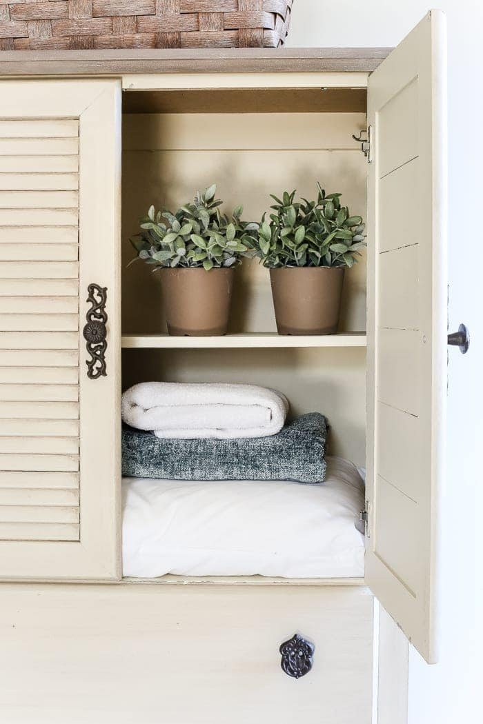Faux Antique Shutter Armoire Makeover | unigumushane.com - A basic veneer cabinet gets a faux antique makeover using Fusion Mineral Paint in the color Plaster aged with Espresso wax and cast iron hardware.