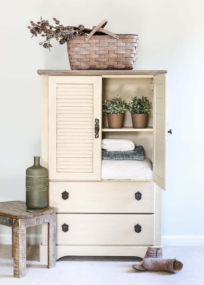 Faux Antique Shutter Armoire Makeover | unigumushane.com - A basic veneer cabinet gets a faux antique makeover using Fusion Mineral Paint in the color Plaster aged with Espresso wax and cast iron hardware.
