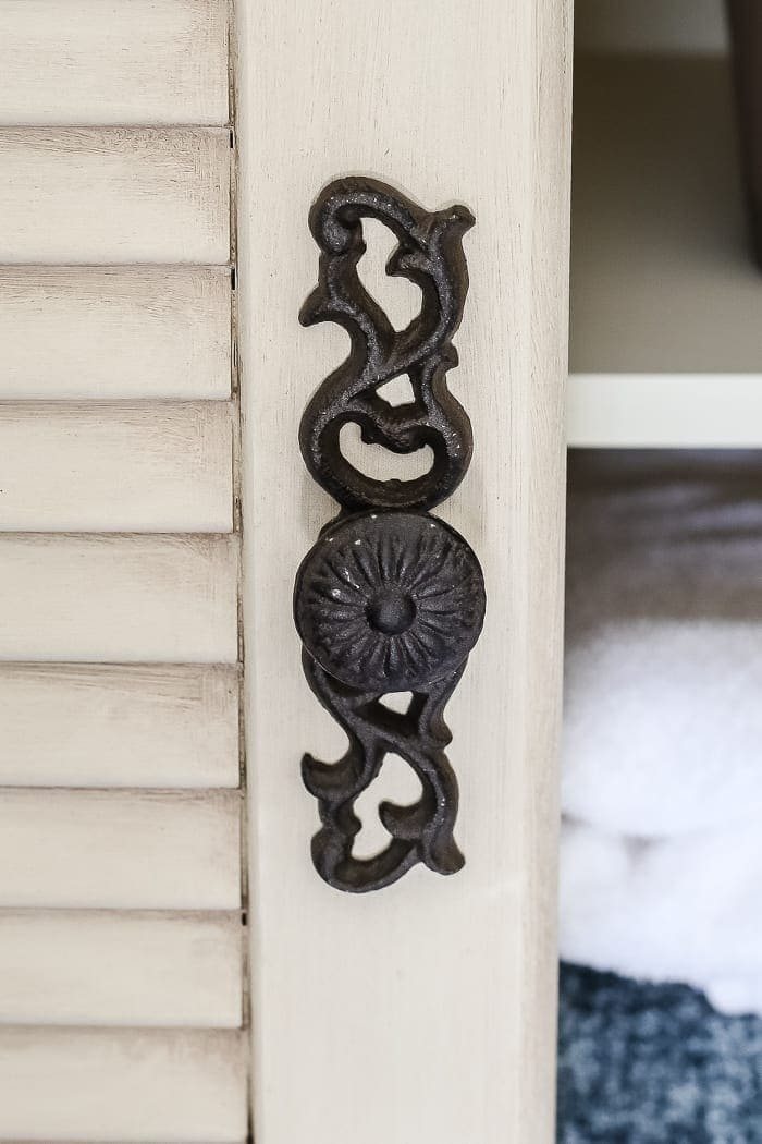 Faux Antique Shutter Armoire Makeover | unigumushane.com - A basic veneer cabinet gets a faux antique makeover using Fusion Mineral Paint in the color Plaster aged with Espresso wax and cast iron hardware.