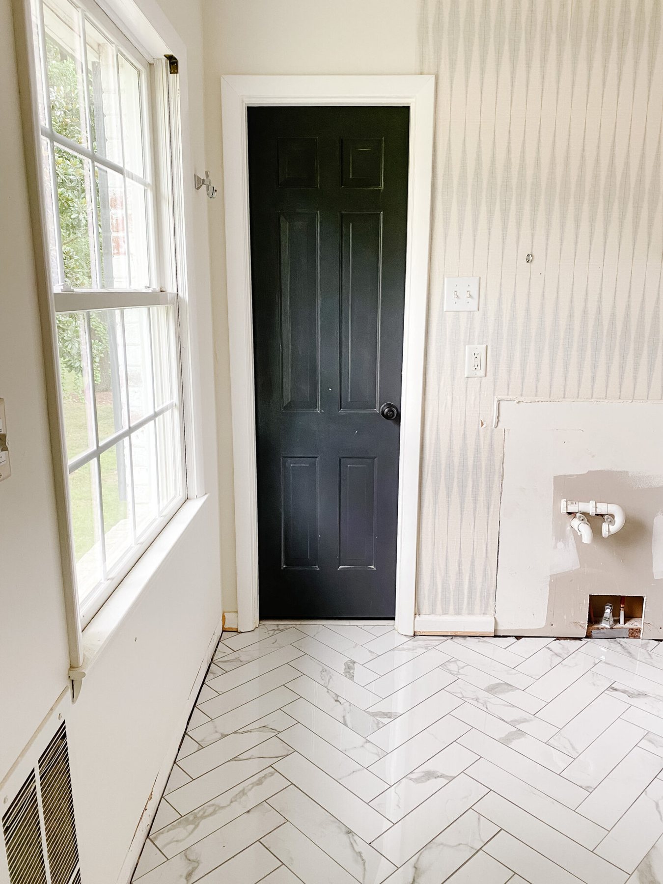 faux marble herringbone tile floor in bathroom renovation